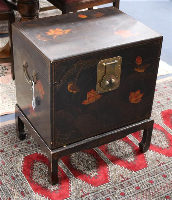 A lacquered box on stand W.52cm